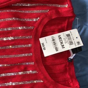 Long sleeve red sequin shirt.